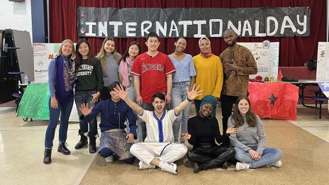 Mohcine 鈥淢o鈥� Khadraoui and 12 other  51国产视频students posing for a photo on International Day